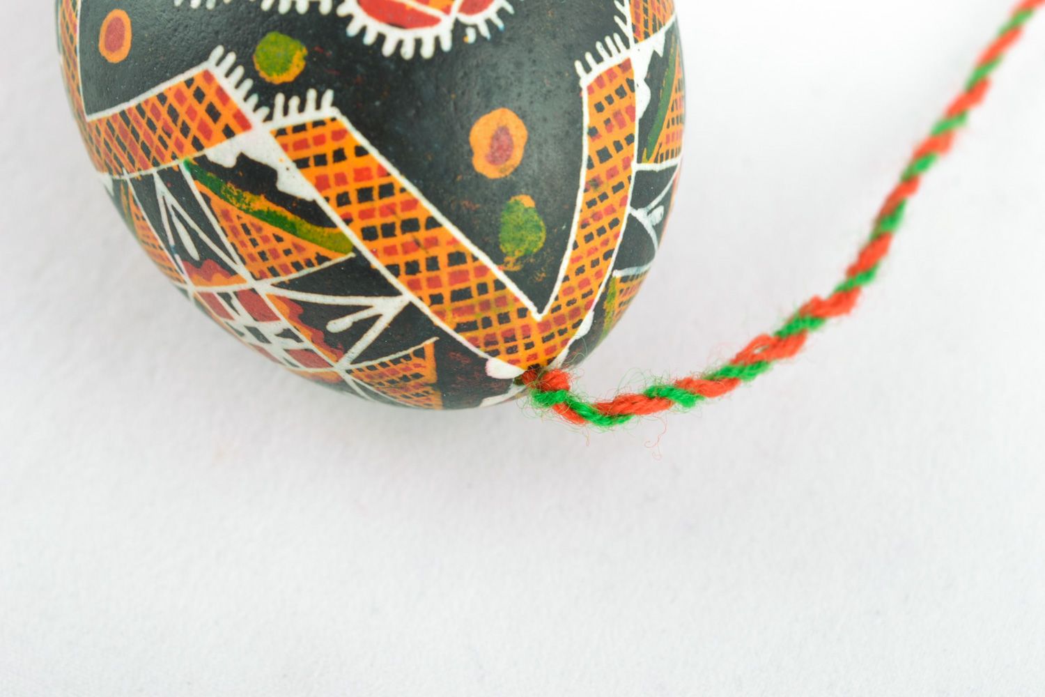 Handmade Easter egg painted with melted wax with tassels for home decoration photo 4