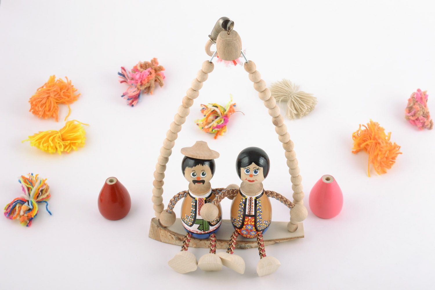 Handmade designer decorative wooden painted doll on a swing bench eco toys for kids photo 1