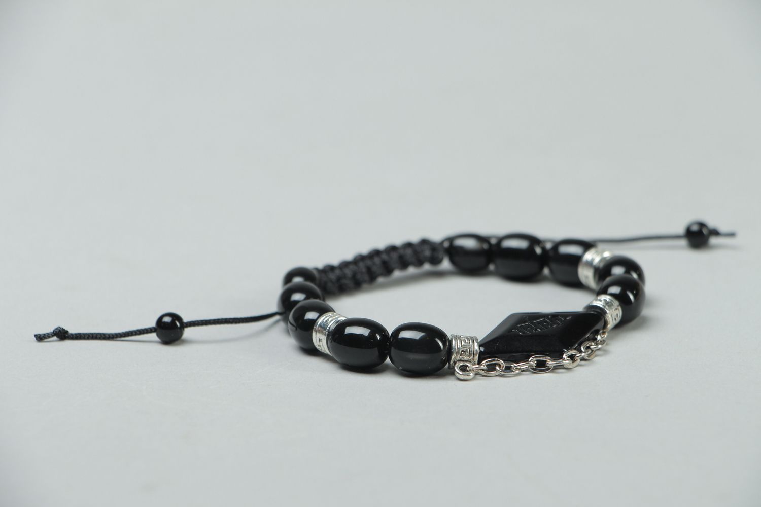 Woven bracelet with black beads photo 2