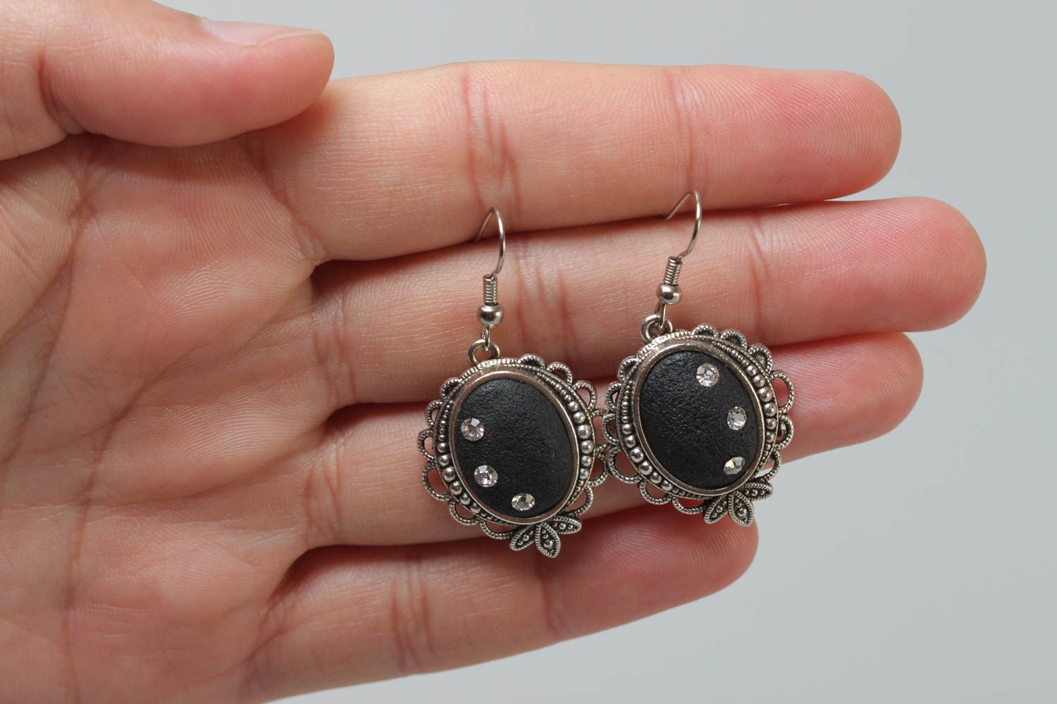 Black handmade oval polymer clay earrings in metal frame photo 5