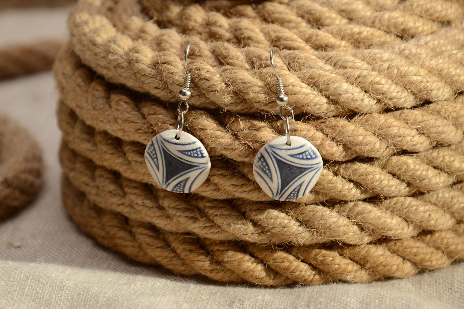 Handmade clay dangle round earrings with pattern of light color photo 1
