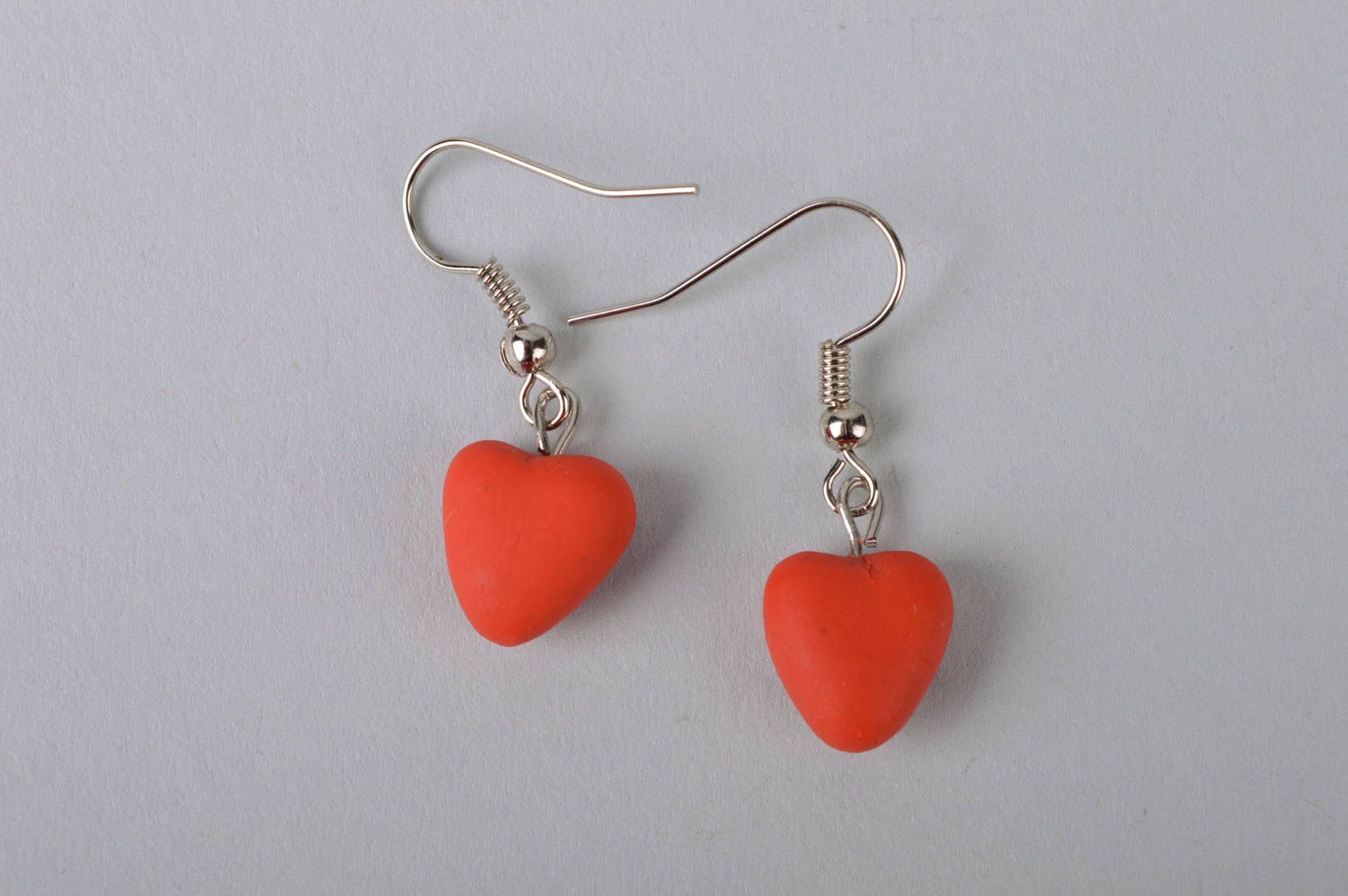 Handmade laconic romantic dangle earrings with small cold porcelain red hearts photo 2