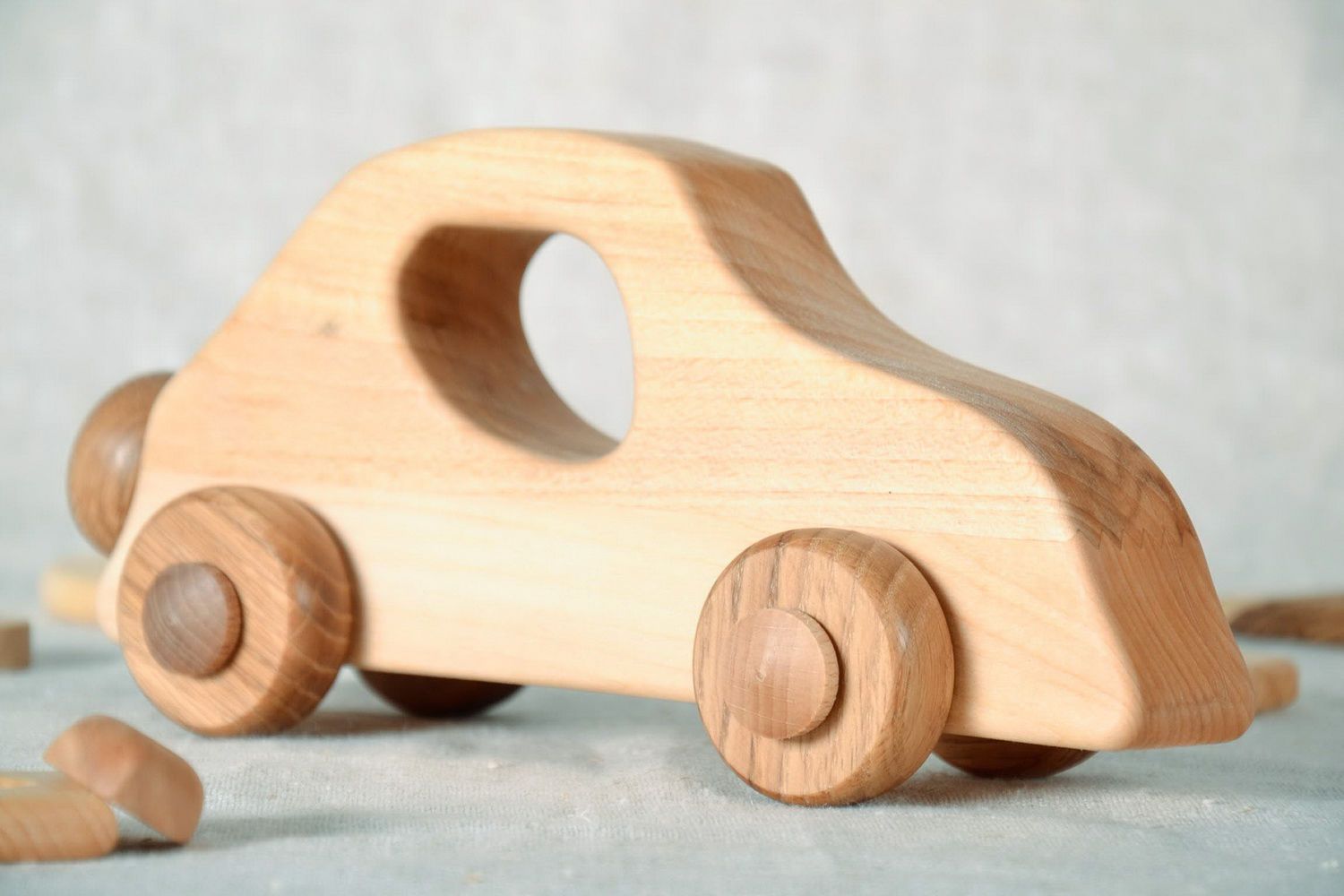 Wooden toy on wheels Car photo 3