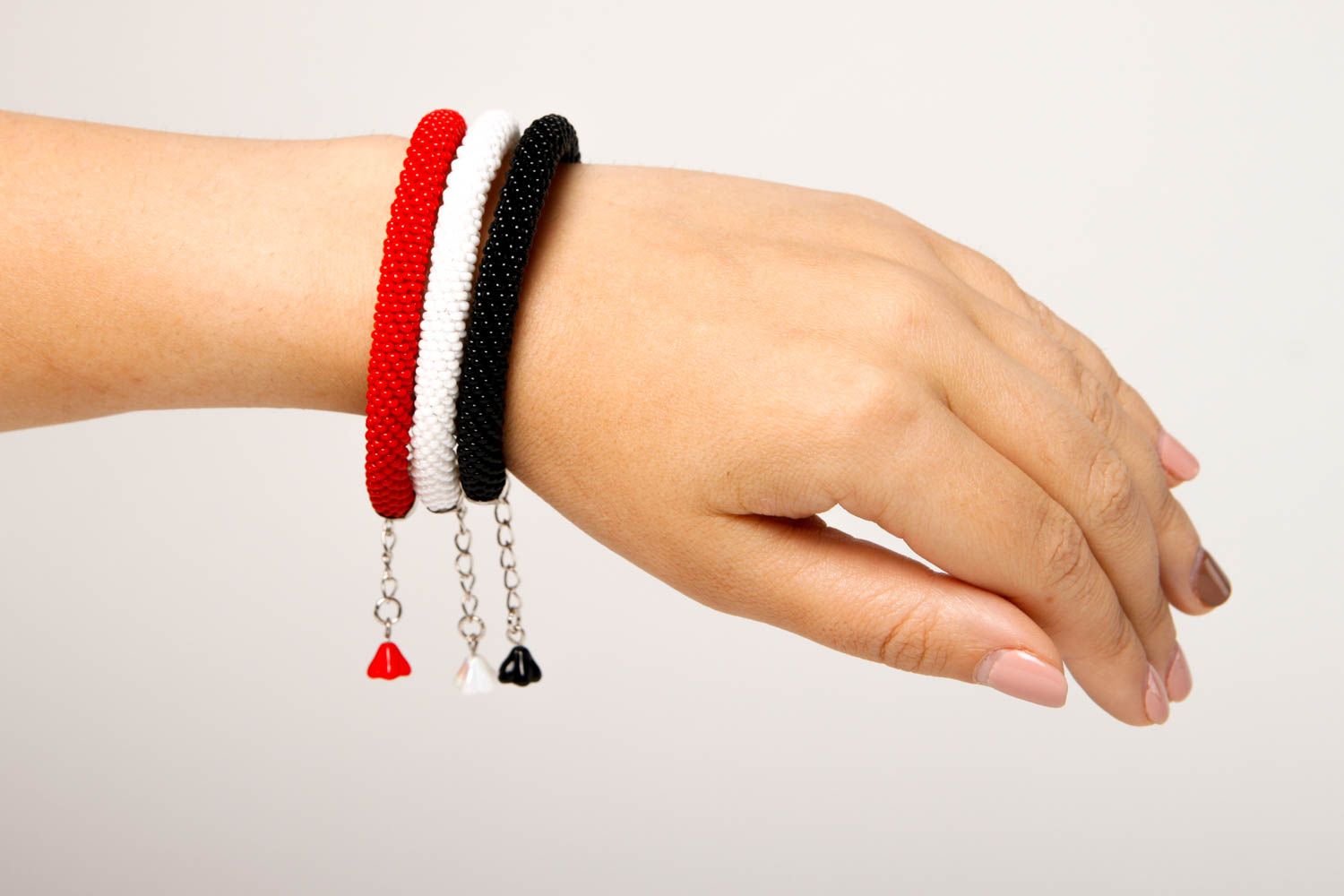 Handmade three-row beaded cord bracelet in black, red, and white colors photo 2