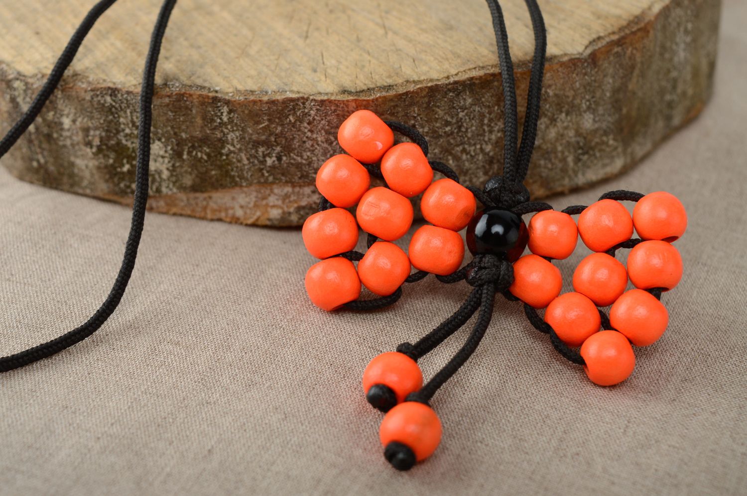 Macrame necklace made of polyester cord and wooden beads photo 1