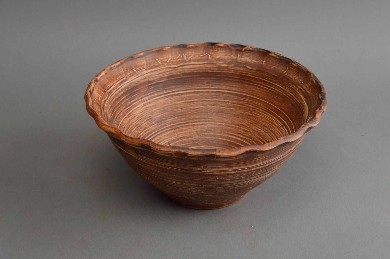 Handmade stylish ethnic ceramic tall bowl with waved edge and narrow bottom photo 3