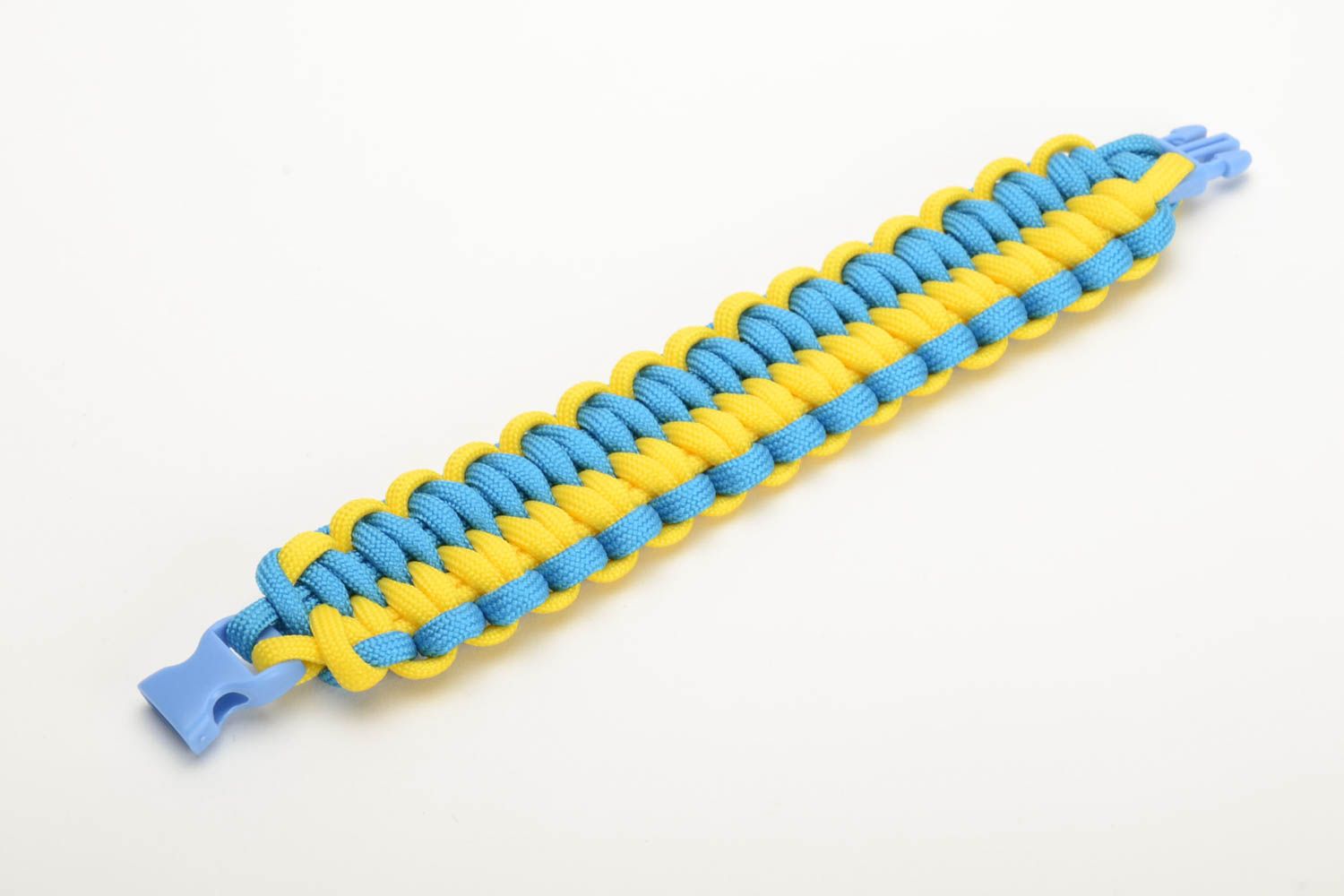 Handmade woven friendship bracelet made of paracord yellow with blue beautiful stylish accessory photo 4