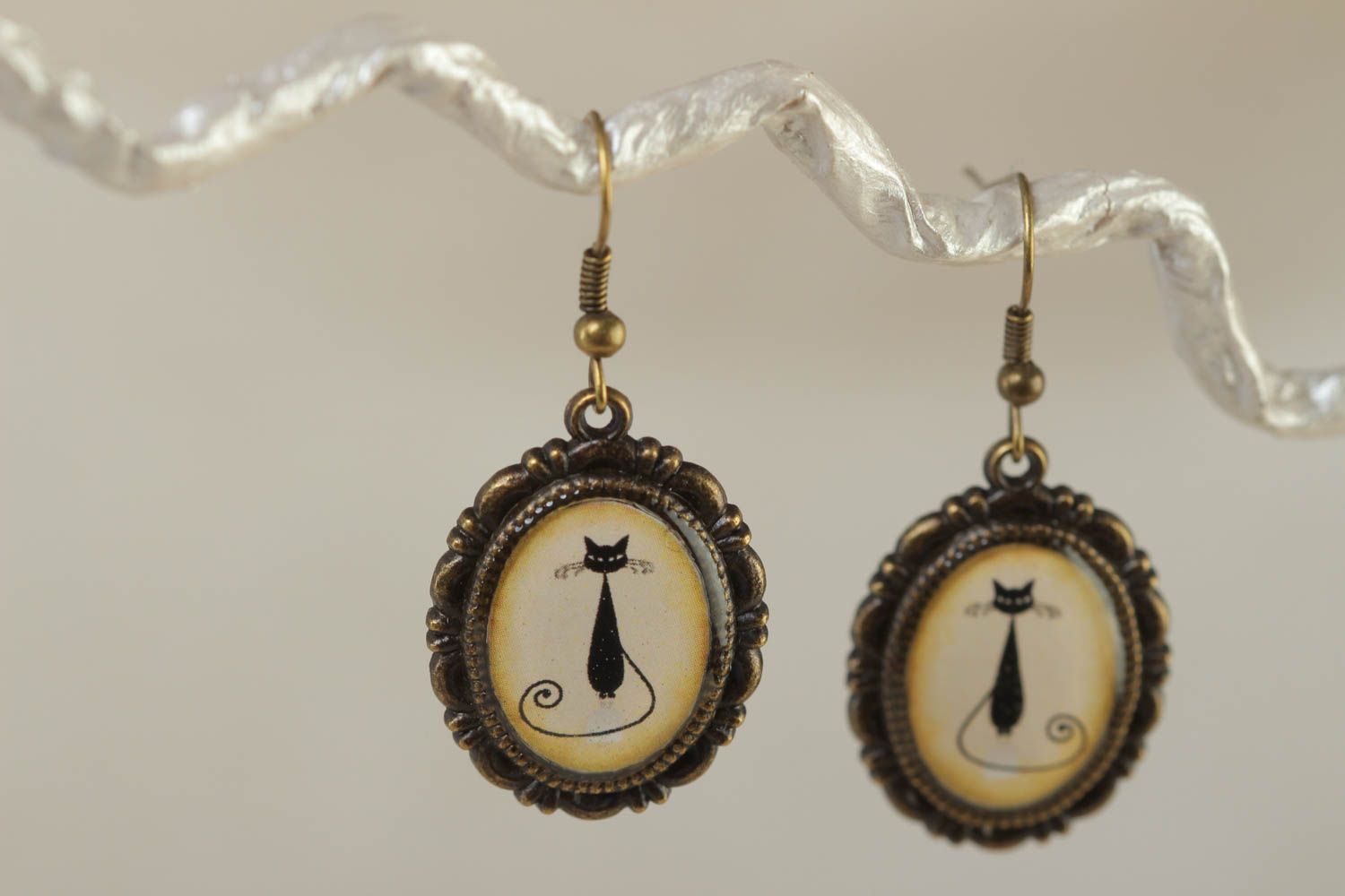 Beautiful beige handmade dangle oval earrings with kitties image photo 1
