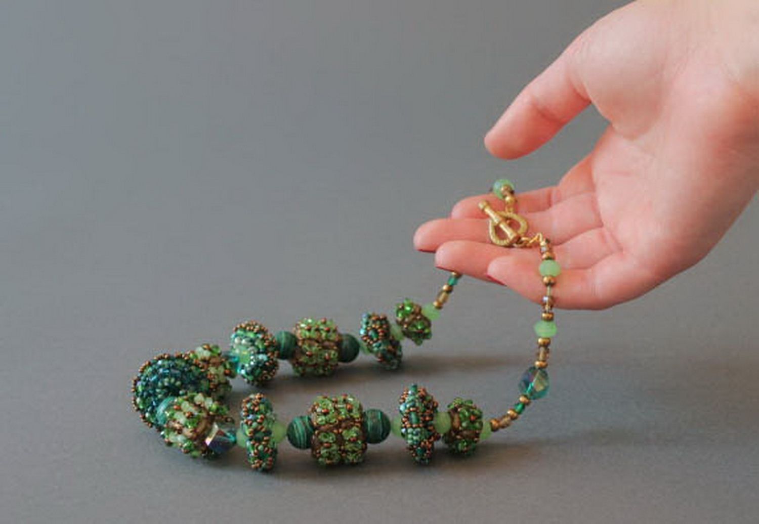 Handmade beaded necklace with decorative stones photo 9