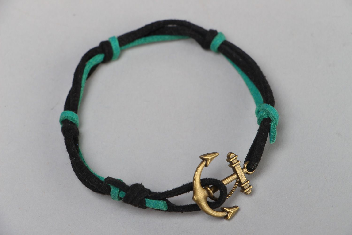 Handmade friendship wrist bracelet woven of faux suede with anchor shaped charm photo 2
