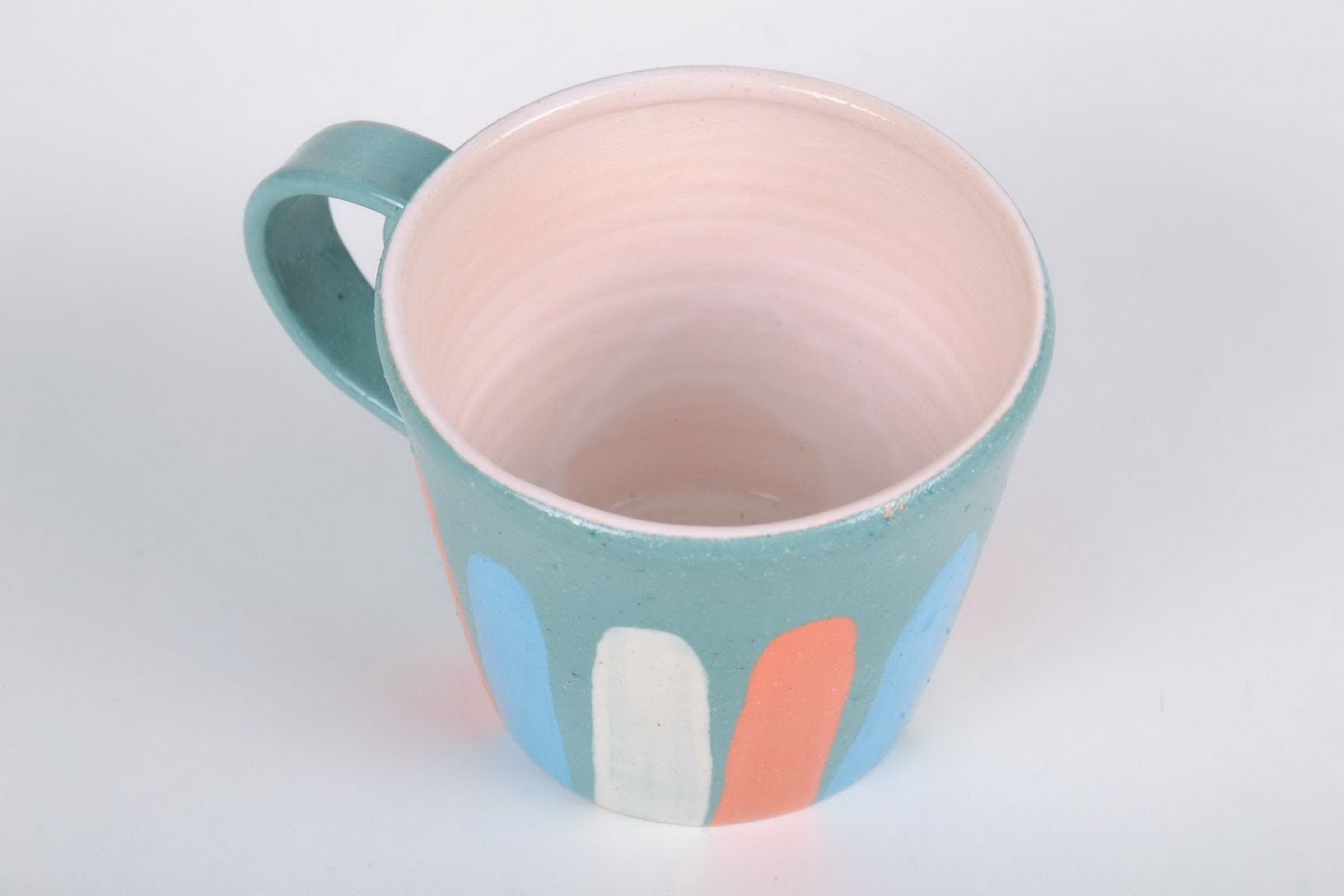 Porcelain cup with handle in blue, white, and orange color photo 2