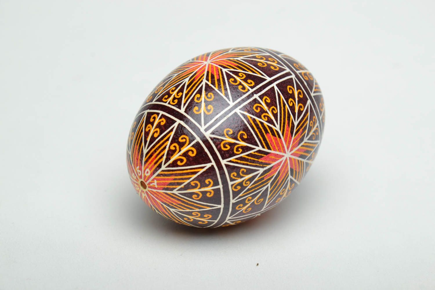 Handmade decorative Easter egg painted using waxing technique photo 3
