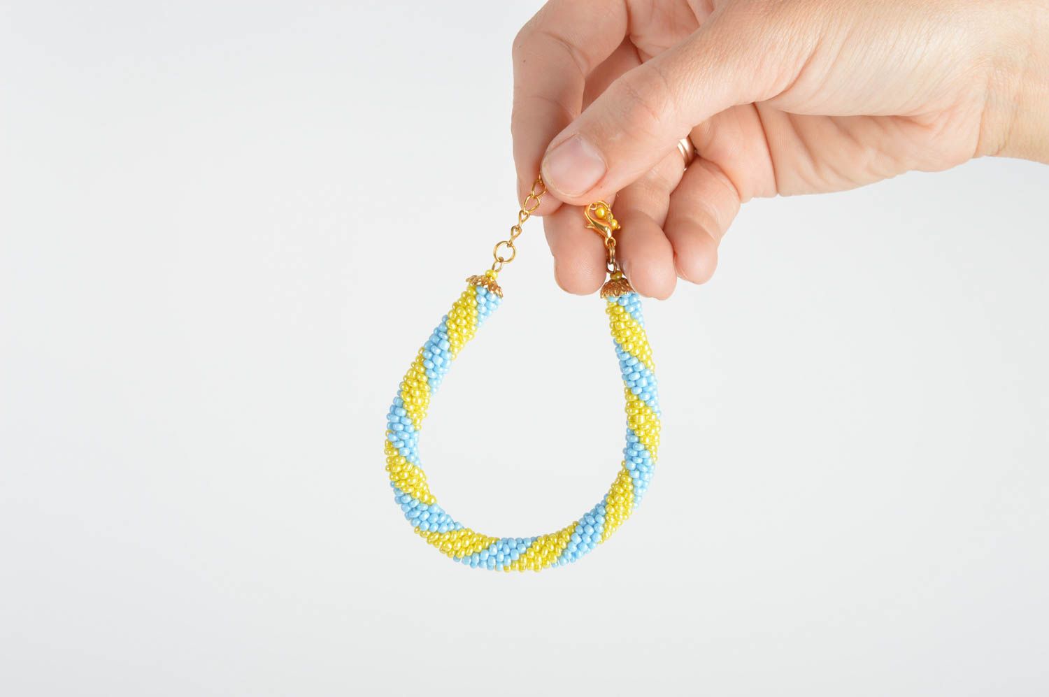 Handmade beaded cord wrist bracelet in blue and yellow colors for women photo 4