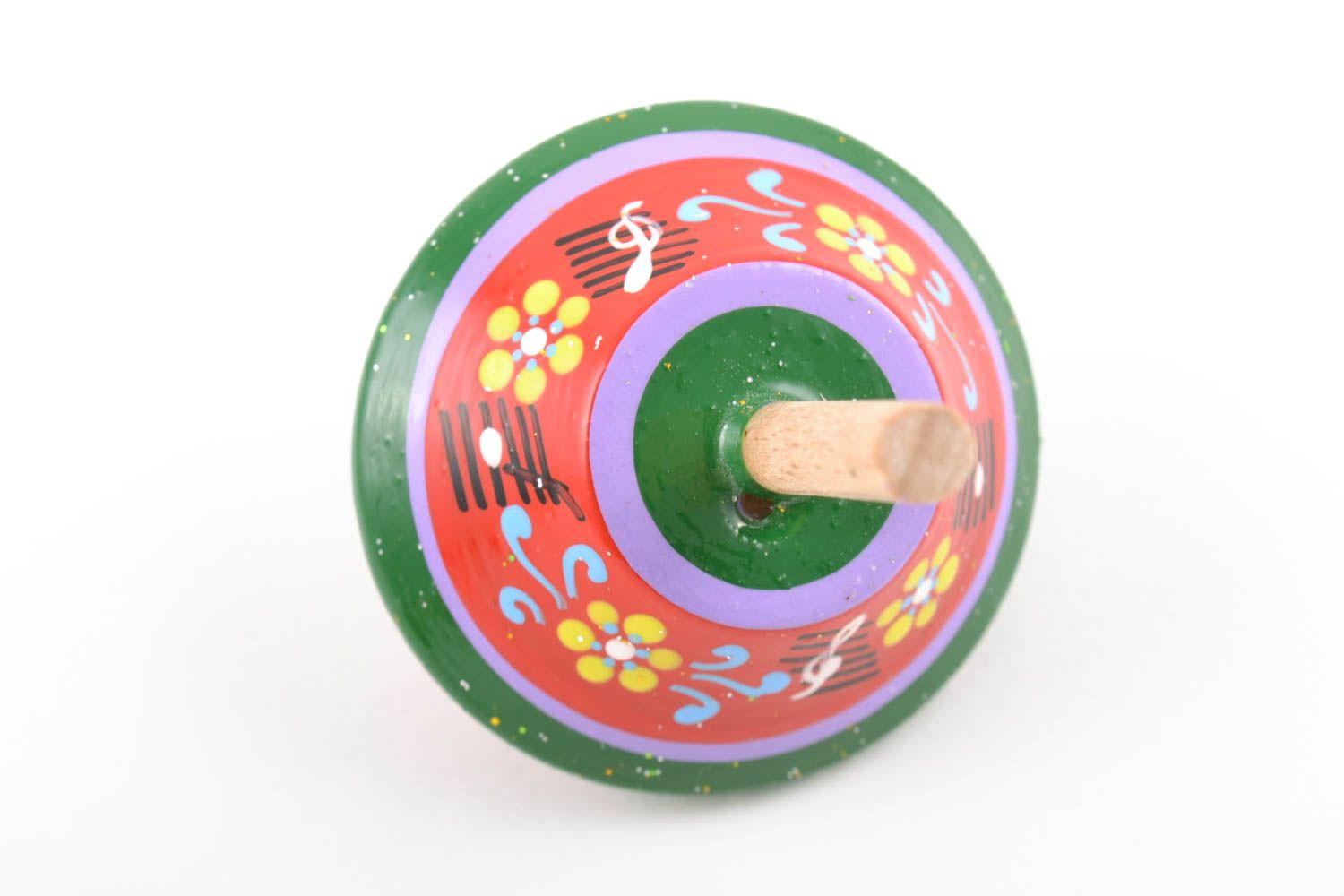 Зелено-красная юла из дерева расписанная эко-красками развивающая игрушка ручной работы фото 3