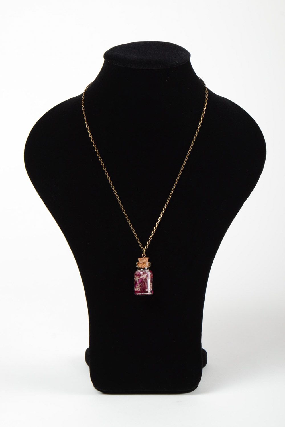 Handmade epoxy resin neck pendant with real flowers inside in the shape of transparent vial photo 2