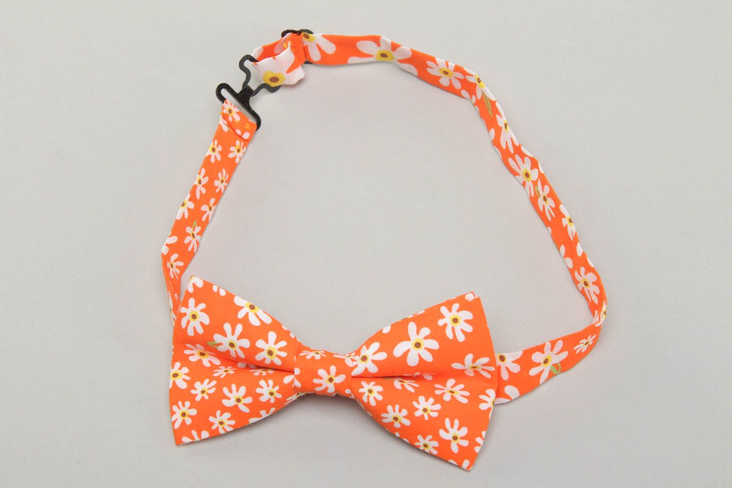 Orange fabric bow tie with floral pattern photo 1