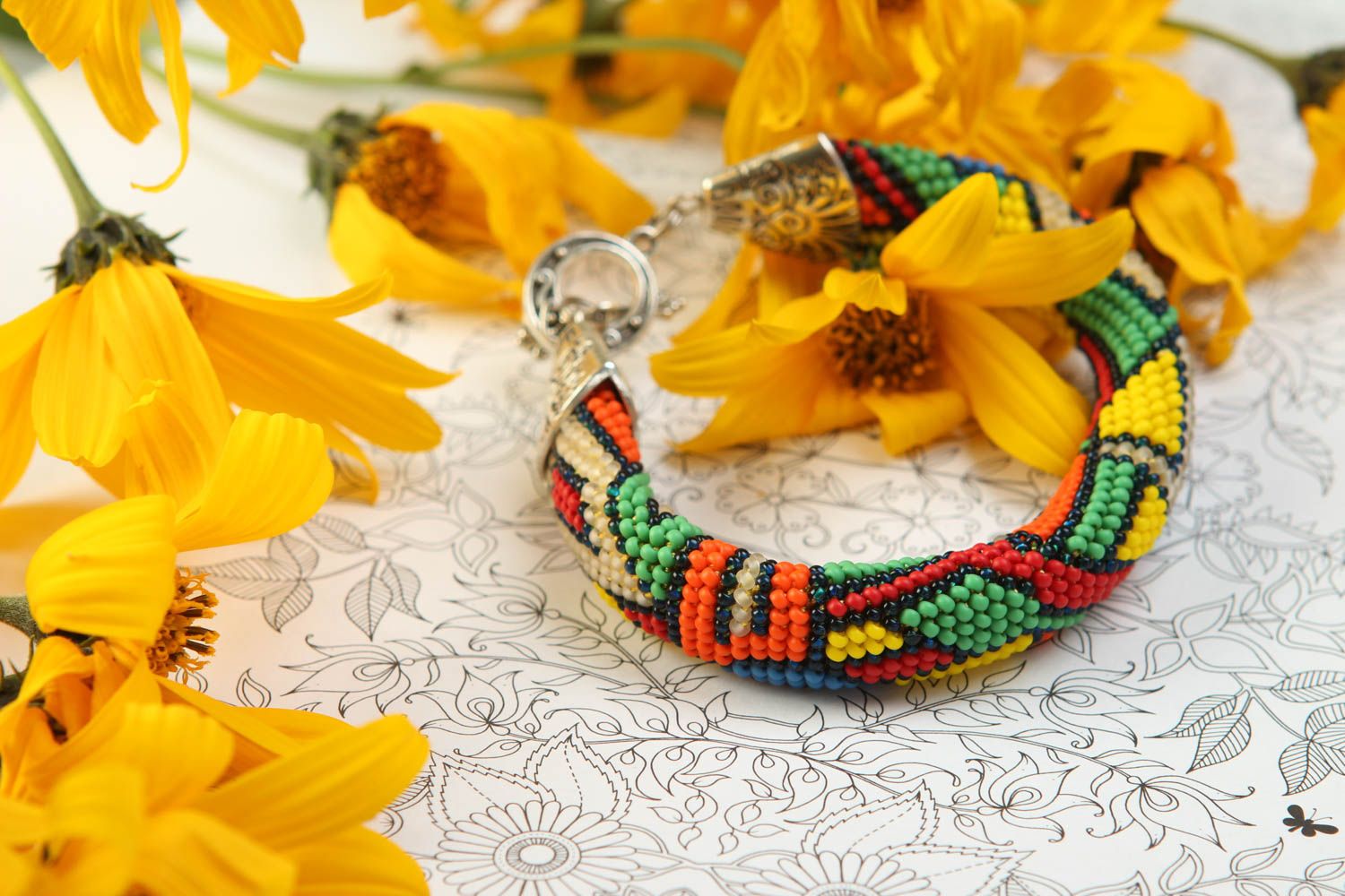 Handmade beaded cord bracelet in geometric style and metal fittings photo 1
