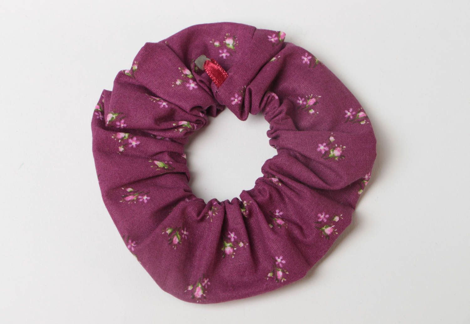 Beautiful handmade textile scrunchy of violet color with flower pattern photo 2