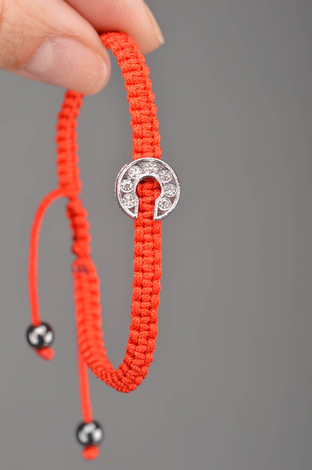 Handmade woven friendship bracelet made of red cords with letter C photo 2