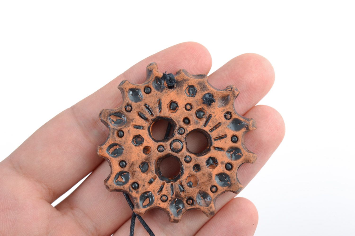 Handmade ceramic middle-sized round pendant in the shape of gear wheel on cord photo 2