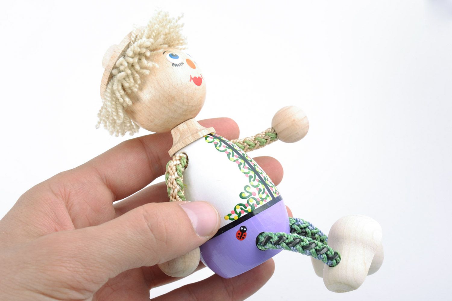 Handmade small funny eco friendly painted wooden toy in the shape of boy for kids photo 2