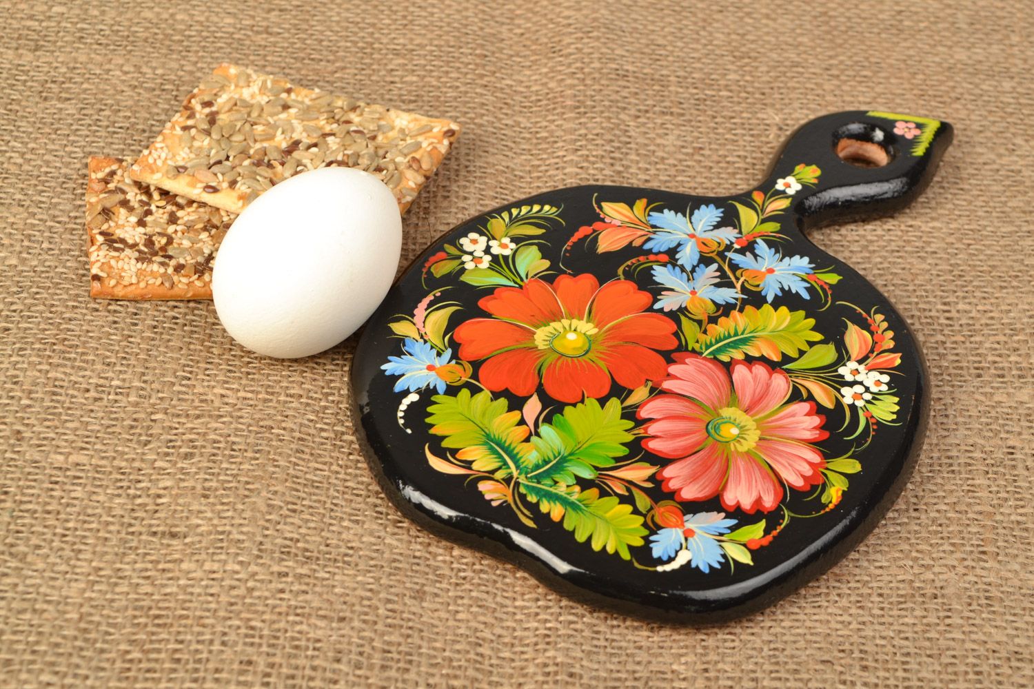 Handmade wooden chopping board with flowers created using Petrikov painting photo 1
