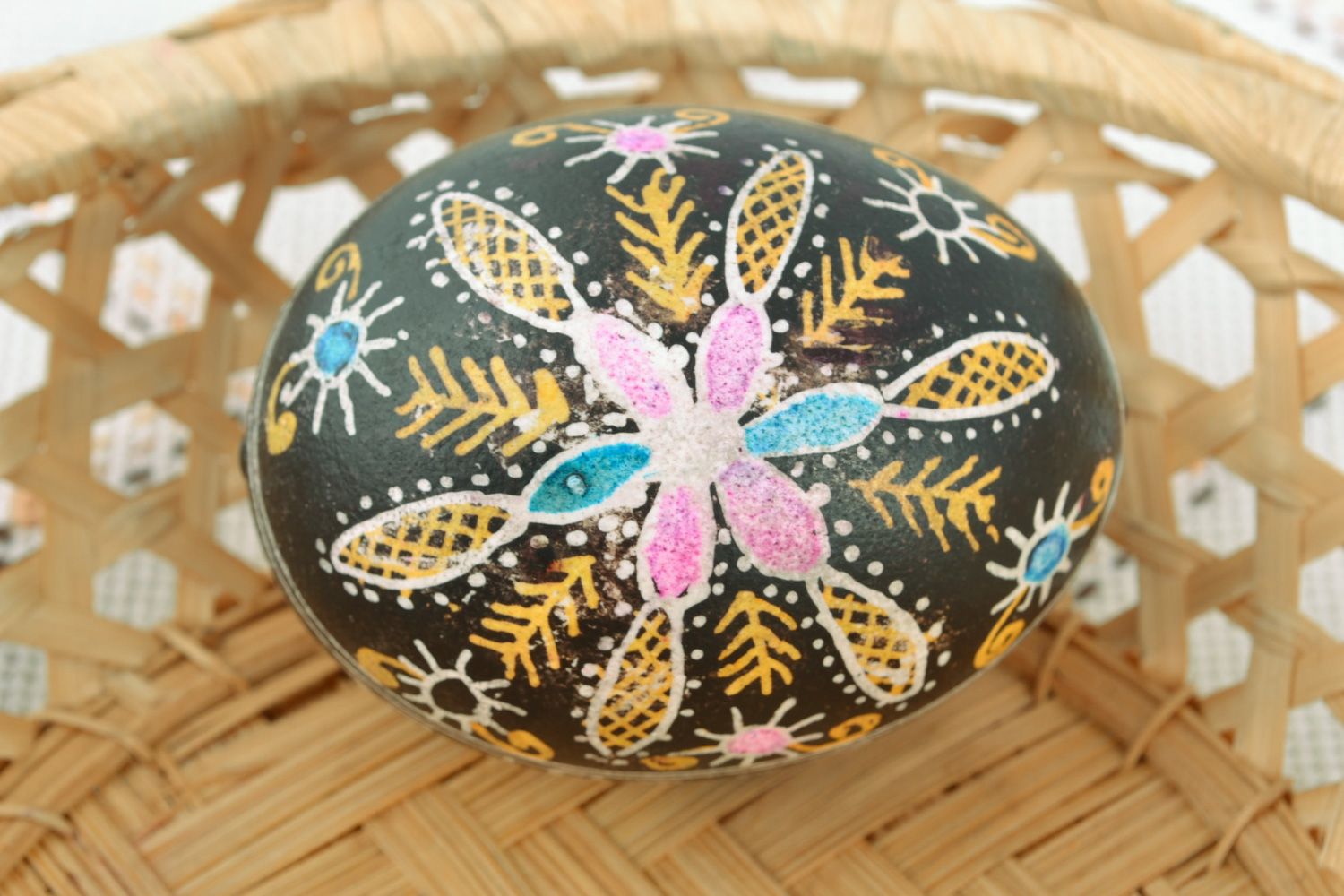 Handmade black Easter egg with flowers painted with hot wax and aniline dyes photo 1