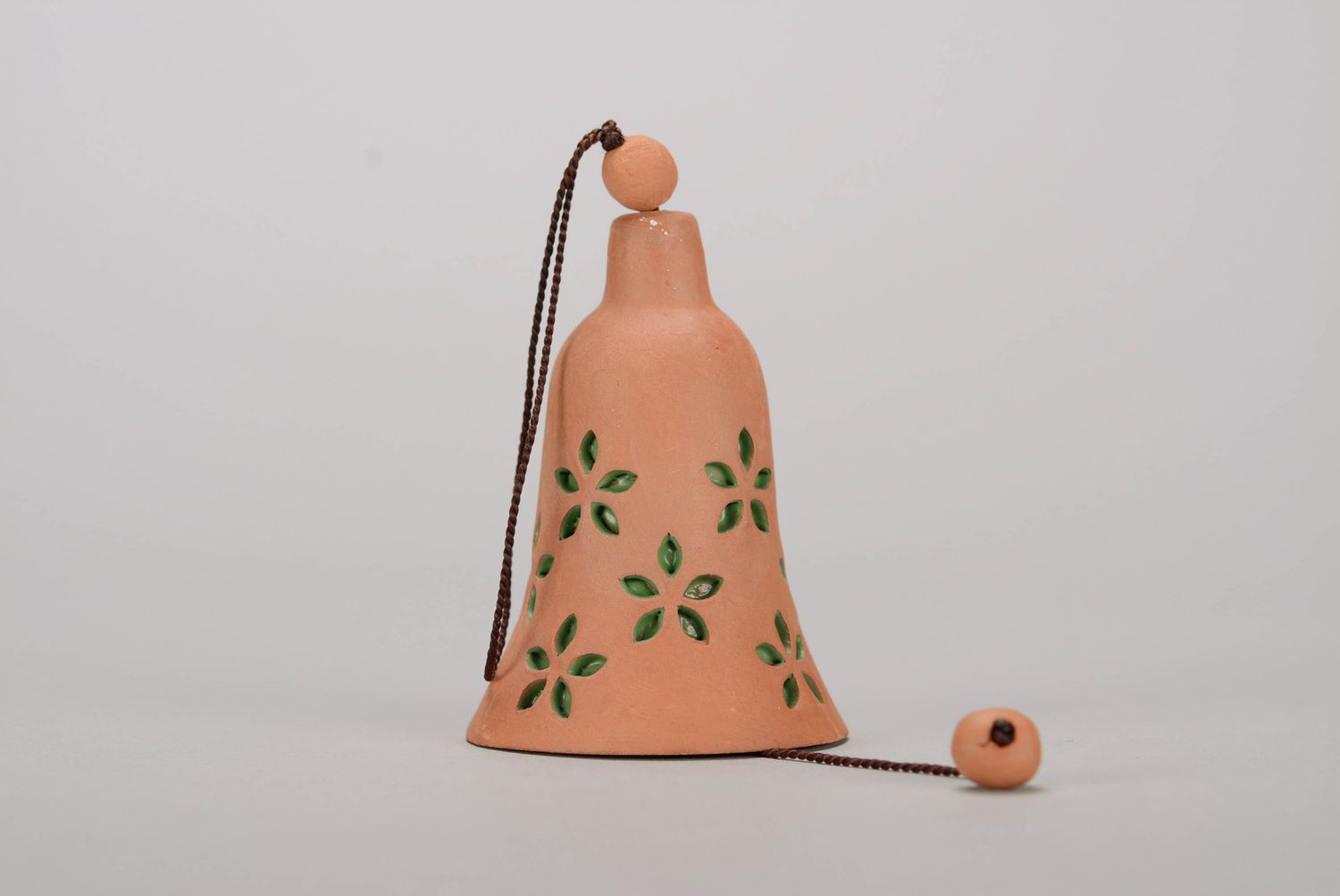 Bell made from red clay with embossment photo 3