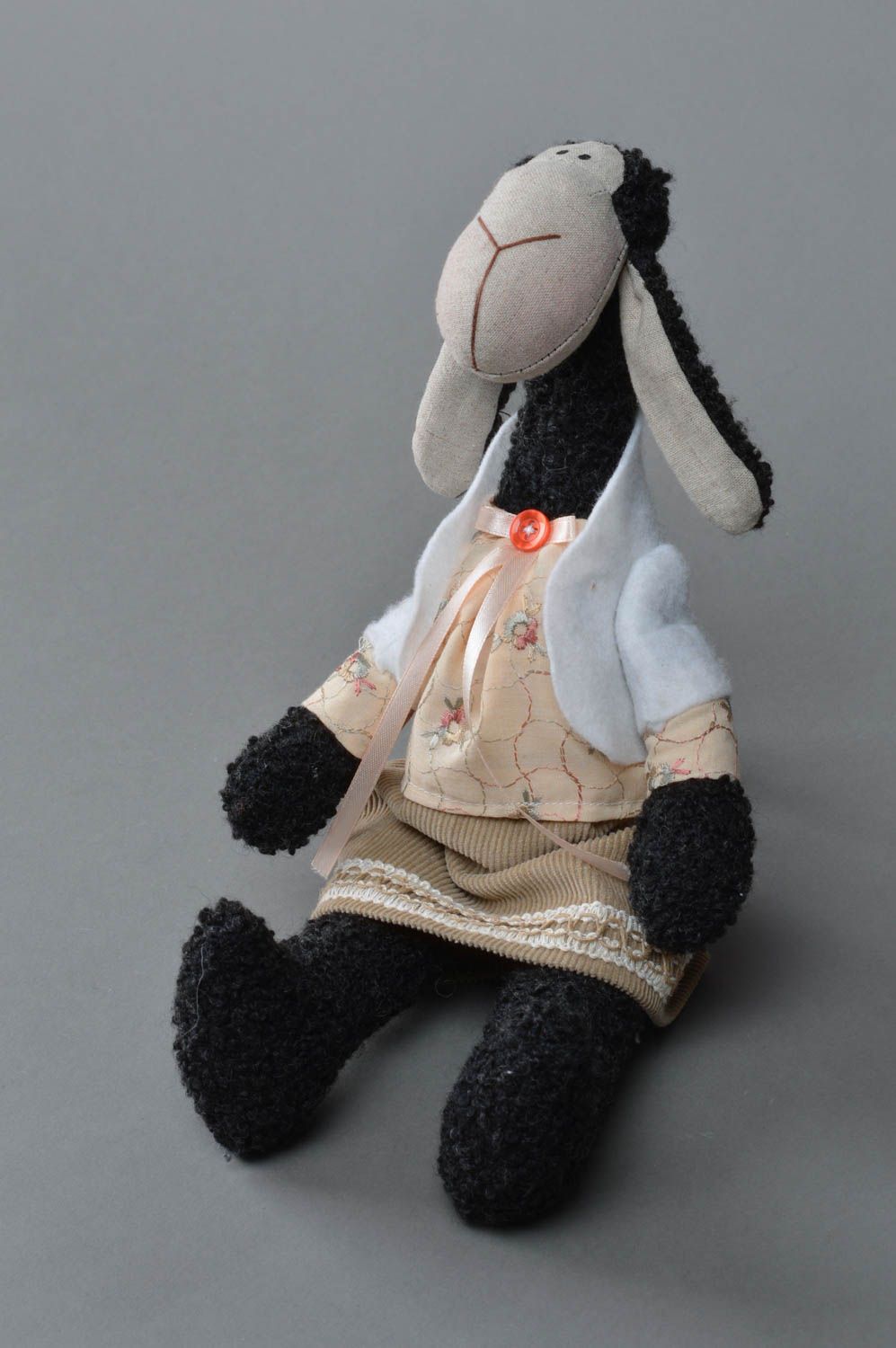Beautiful handmade collectible textile soft toy sewn of felt and artificial fur in the shape of sheep photo 1
