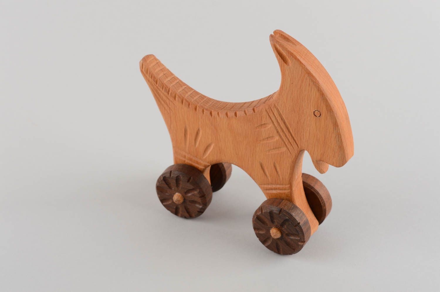 Eco friendly handmade wooden wheeled toy goat for children photo 2