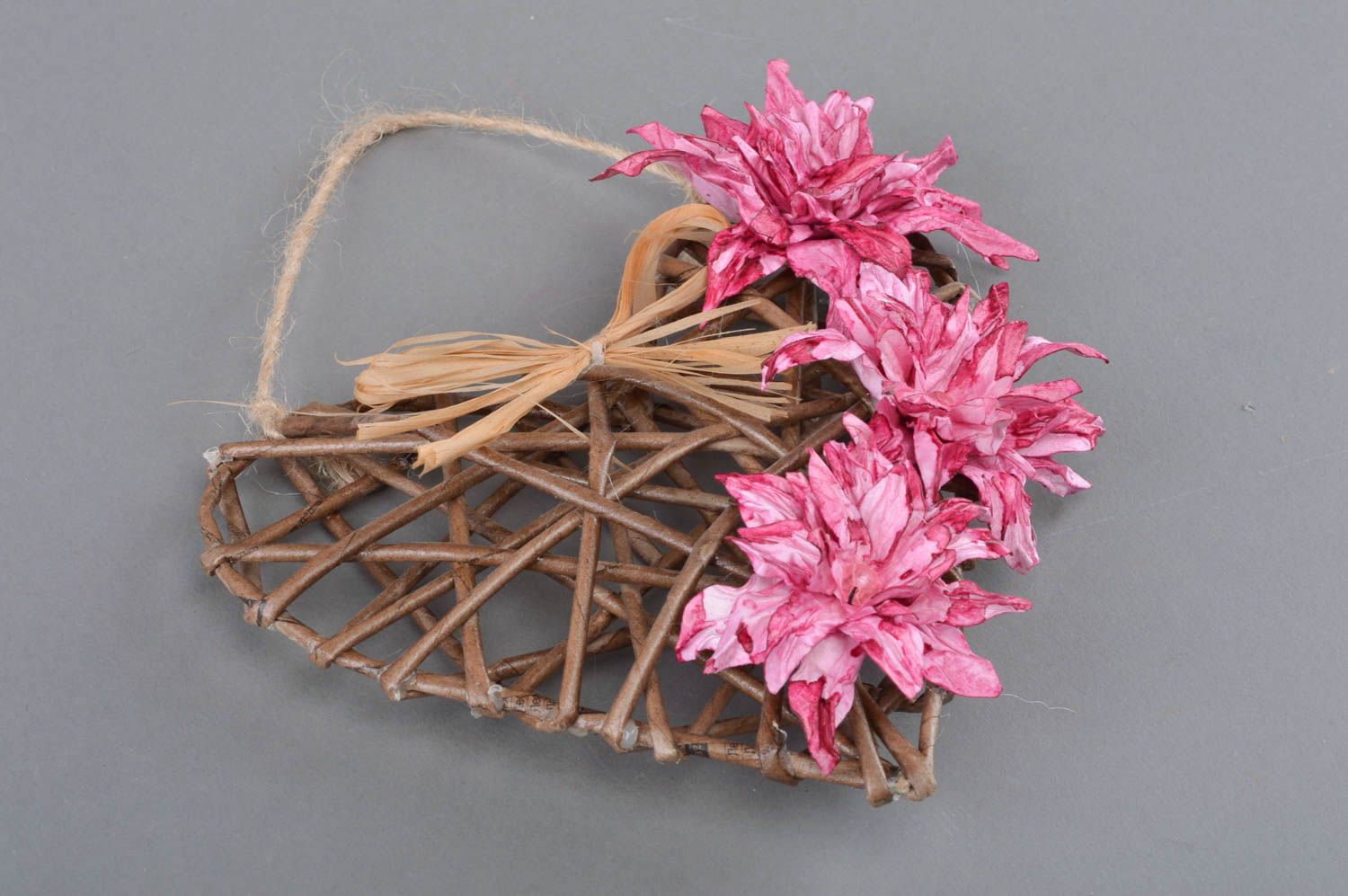 Handmade heart shaped wall hanging decoration woven of paper tubes with flowers photo 1