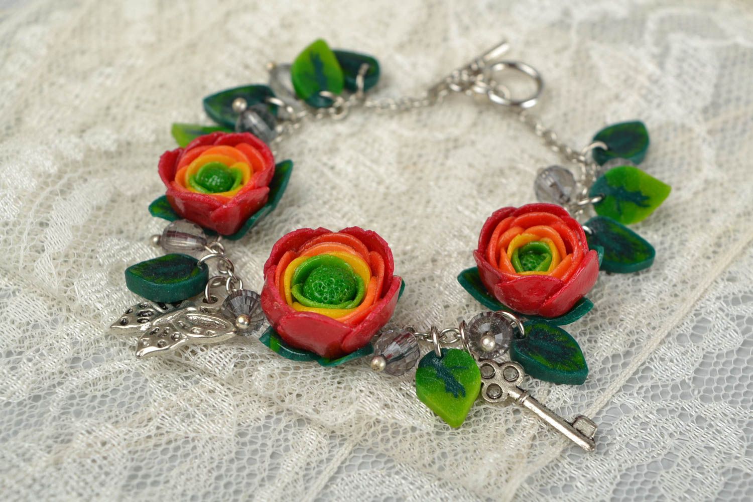 Beautiful women's handmade designer wrist bracelet with plastic flowers photo 2
