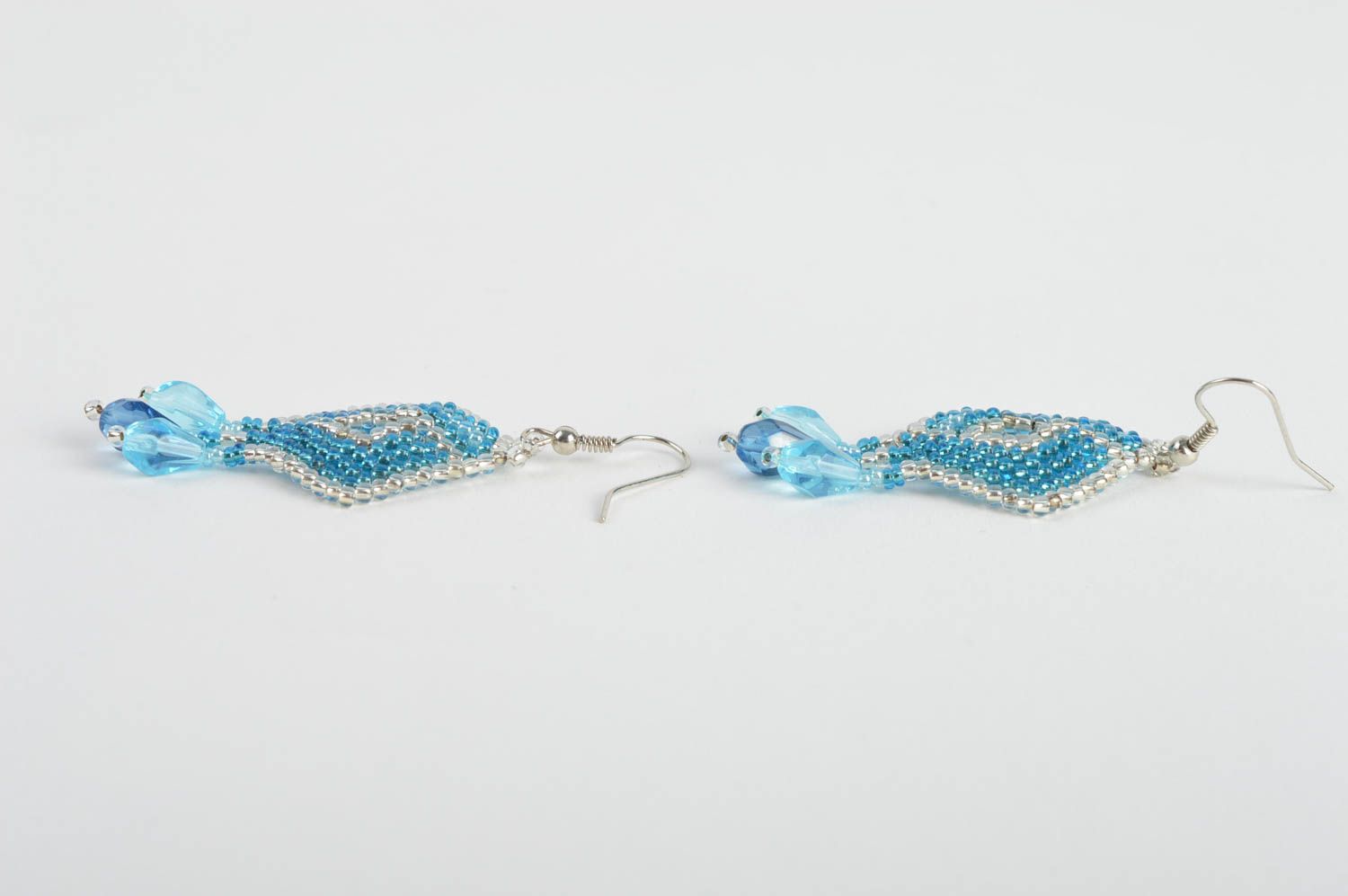 Handmade bead woven dangle earrings in the shape of rhombus of light blue color photo 4