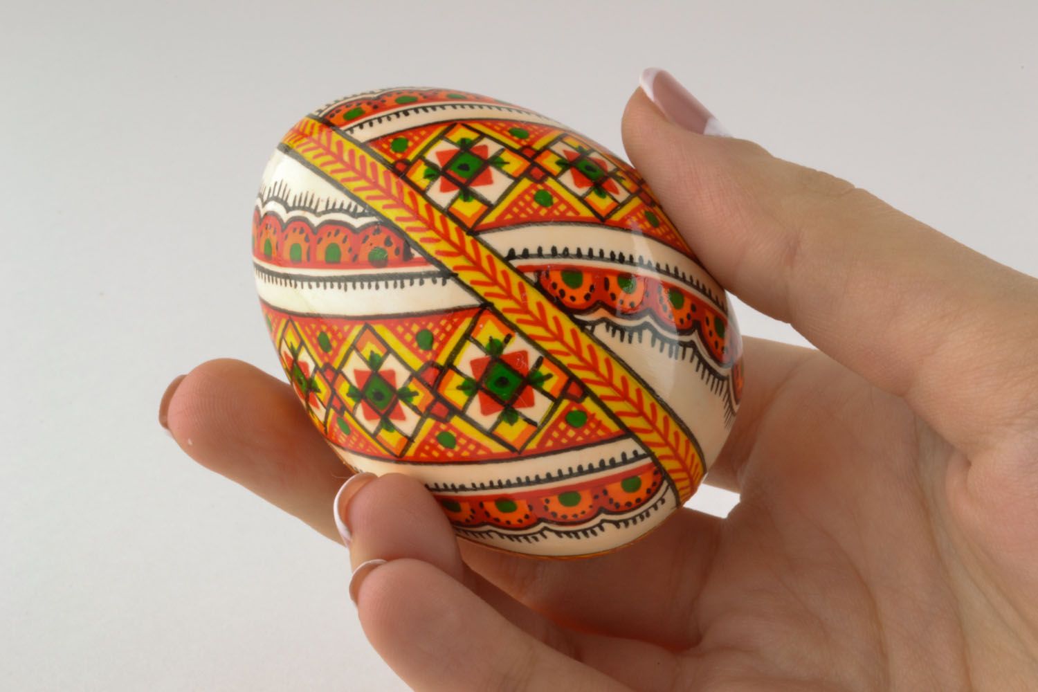 Wooden egg with ethnic painting photo 2