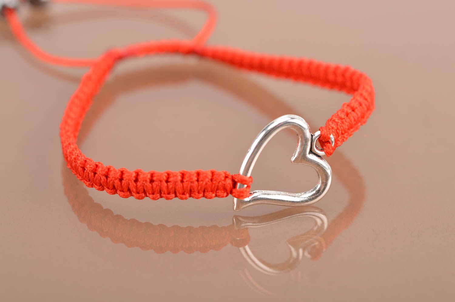 Handmade red bracelet made of silk threads with insert in shape of heart photo 4