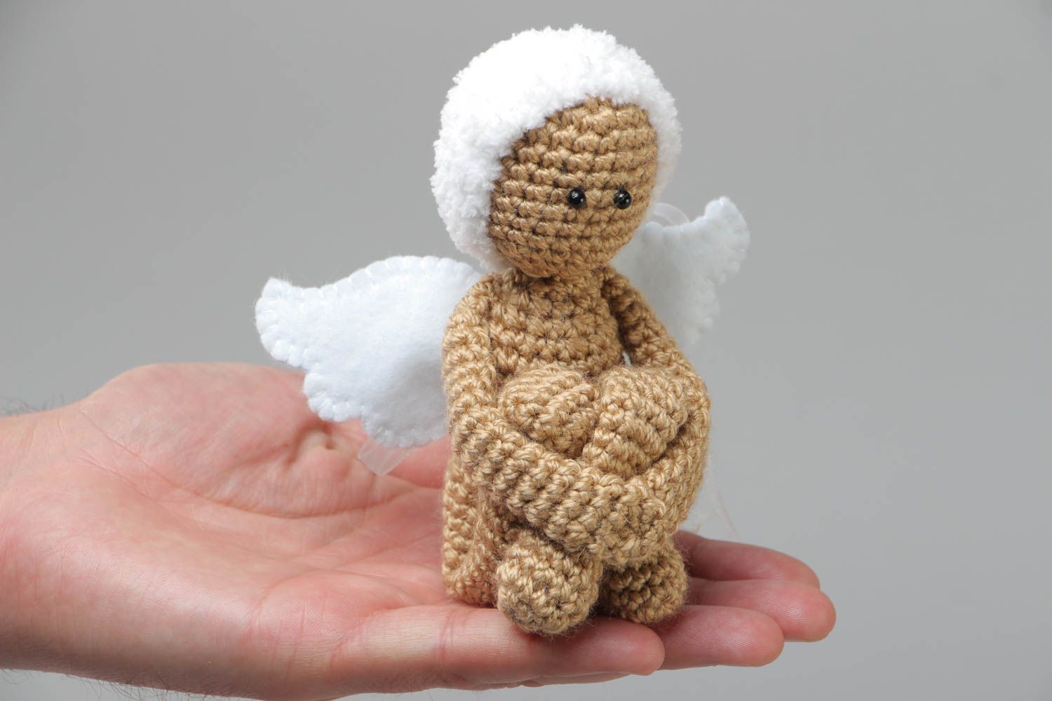 Small handmade knitted angel toy made of acrylic yarn using knitting needle photo 5