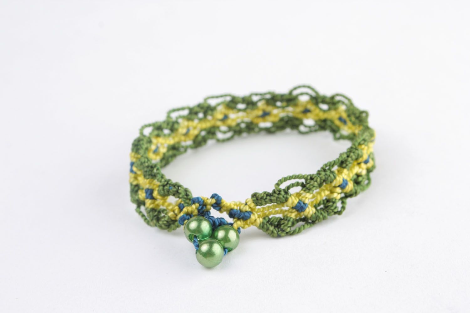 Зеленый плетеный браслет фото 2
