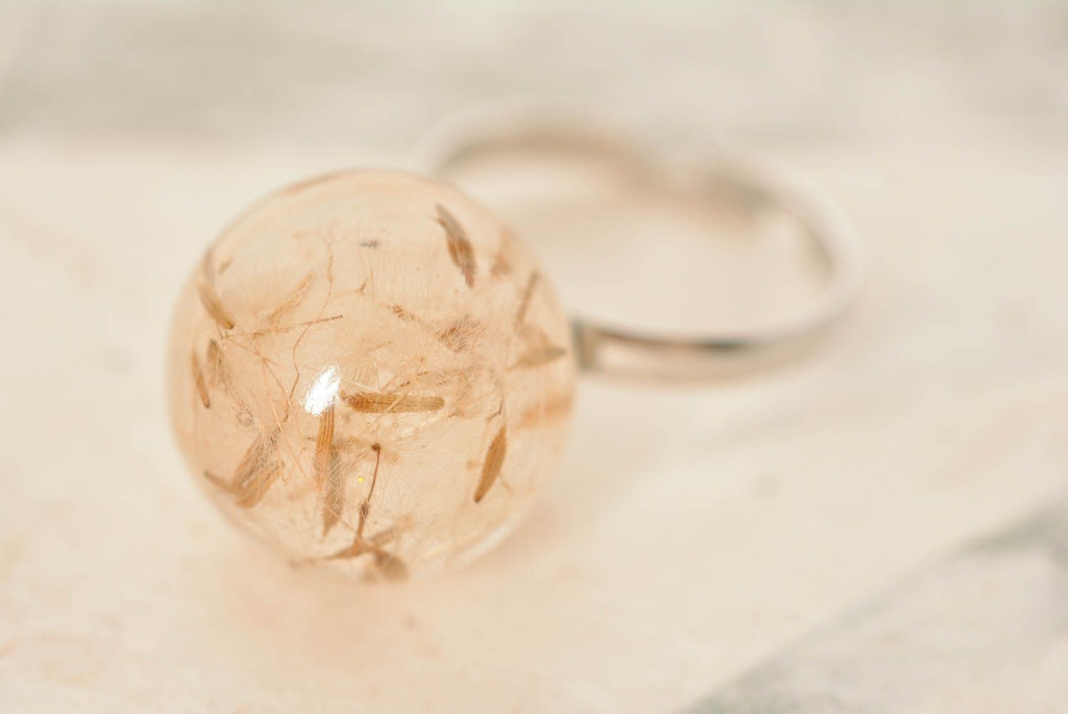 Handmade ring with large transparent epoxy resin ball with dandelion inside photo 1