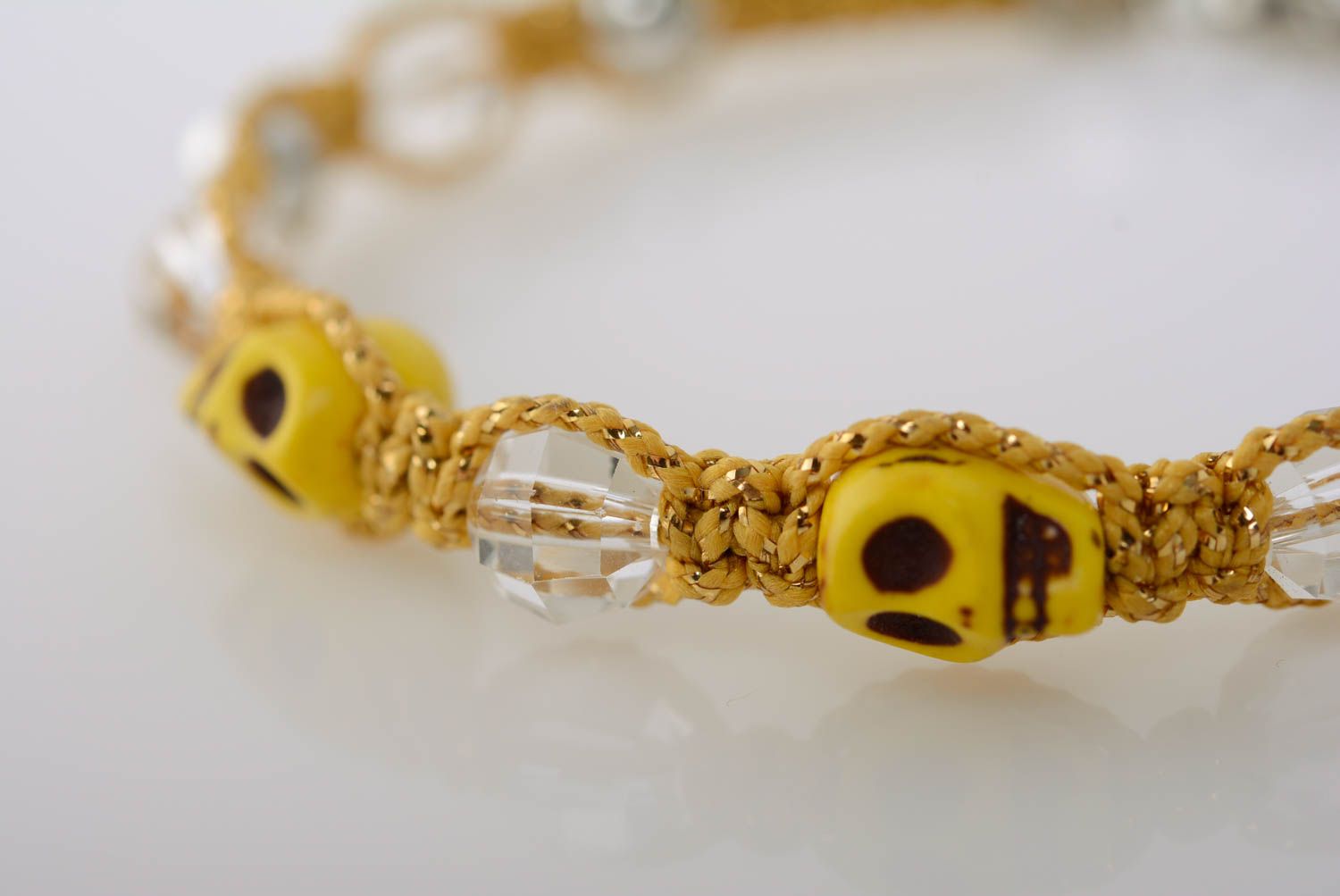 Beautiful yellow handmade macrame woven wrist bracelet with skulls adjustable photo 2