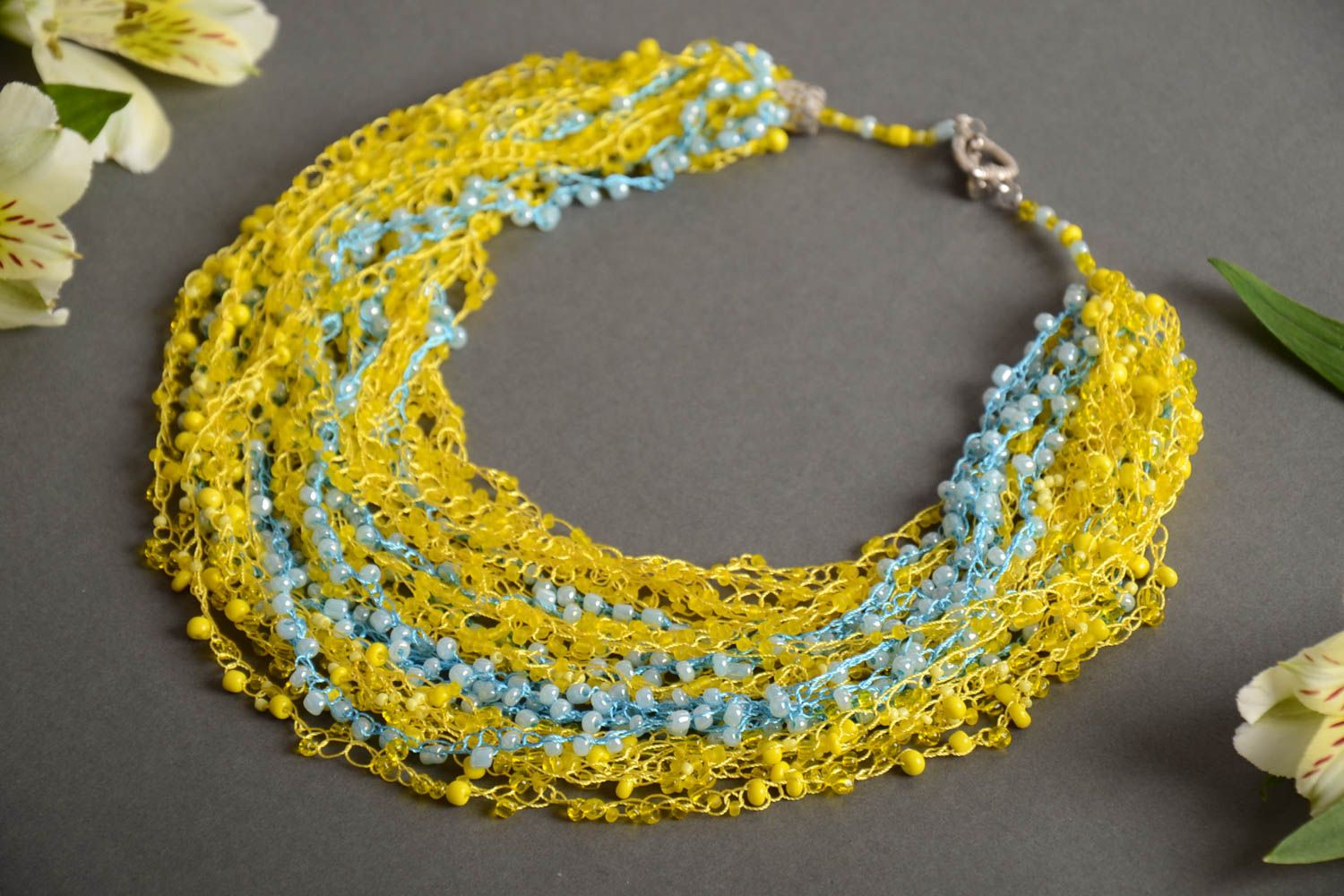 Multirow long handmade airy woven beaded necklace of yellow color photo 1