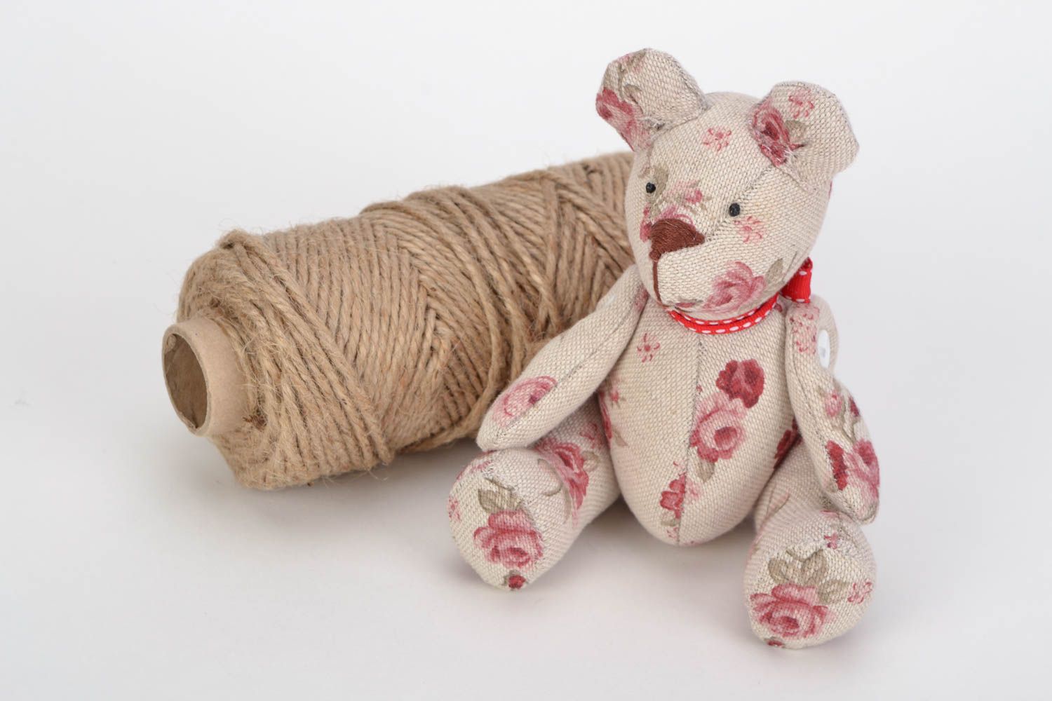 Handmade light fabric soft toy bear with flower print photo 1