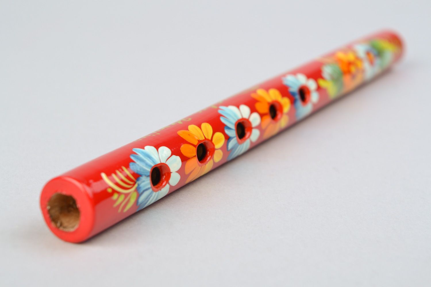 Handmade folk wooden flute with painted with oils in traditional Petrikivka style photo 3