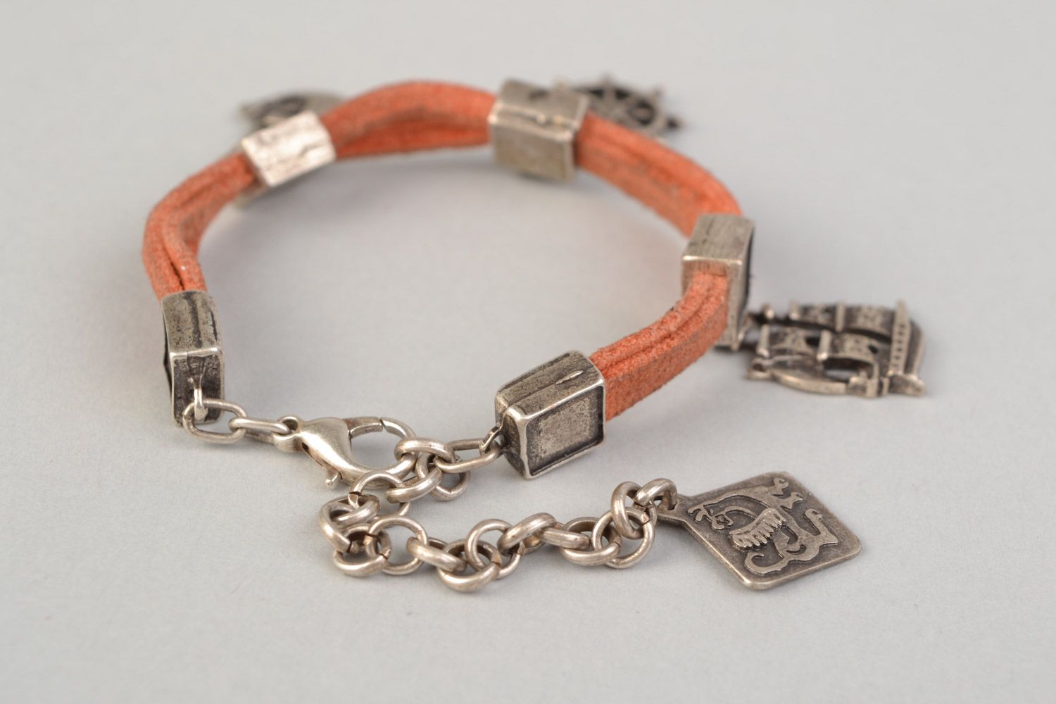 Handmade suede cord bracelet of peach color with metal charms in marine style photo 4