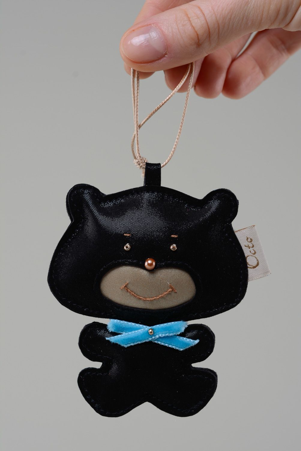Handmade genuine leather keychain in the shape of black bear with blue bow  photo 3