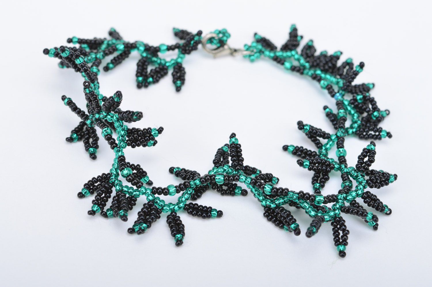 Handmade designer wrist bracelet woven of black and green Czech beads Leaves photo 2