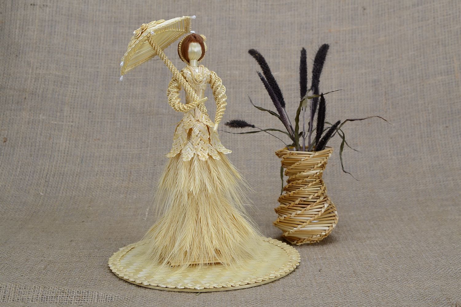 Straw figure Young lady with umbrella photo 1