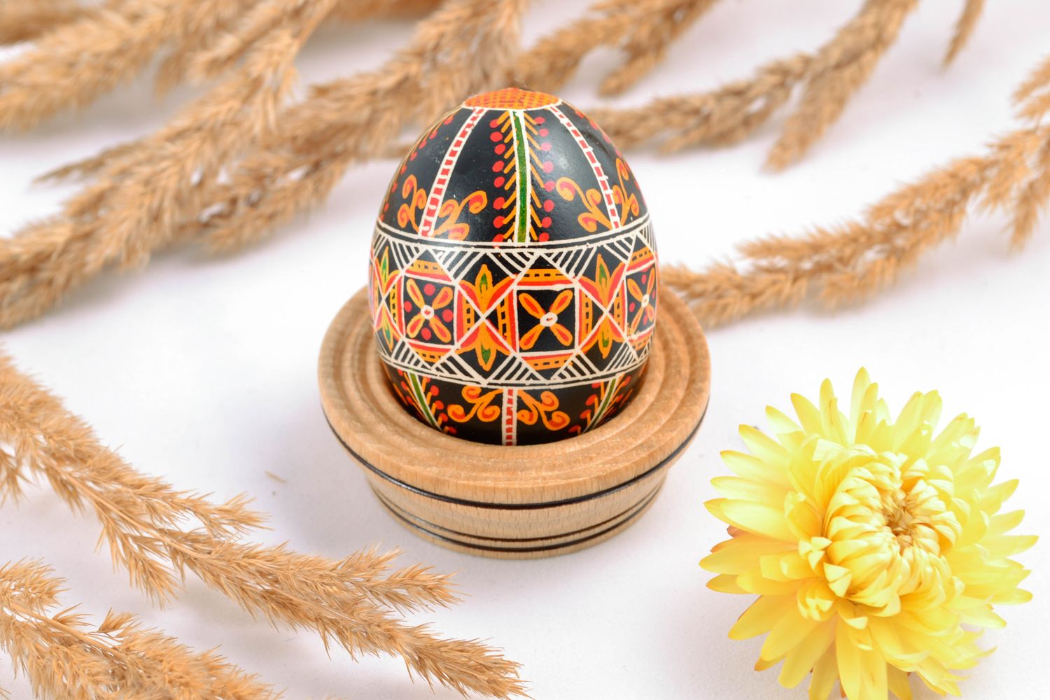 Painted chicken egg for Easter of black color with ornament photo 1