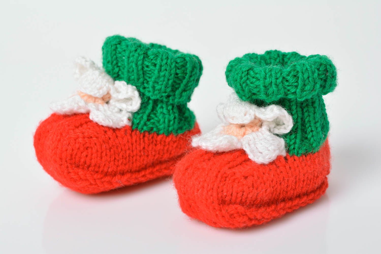 Handmade knitted baby booties made of wool winter socks for small children photo 1