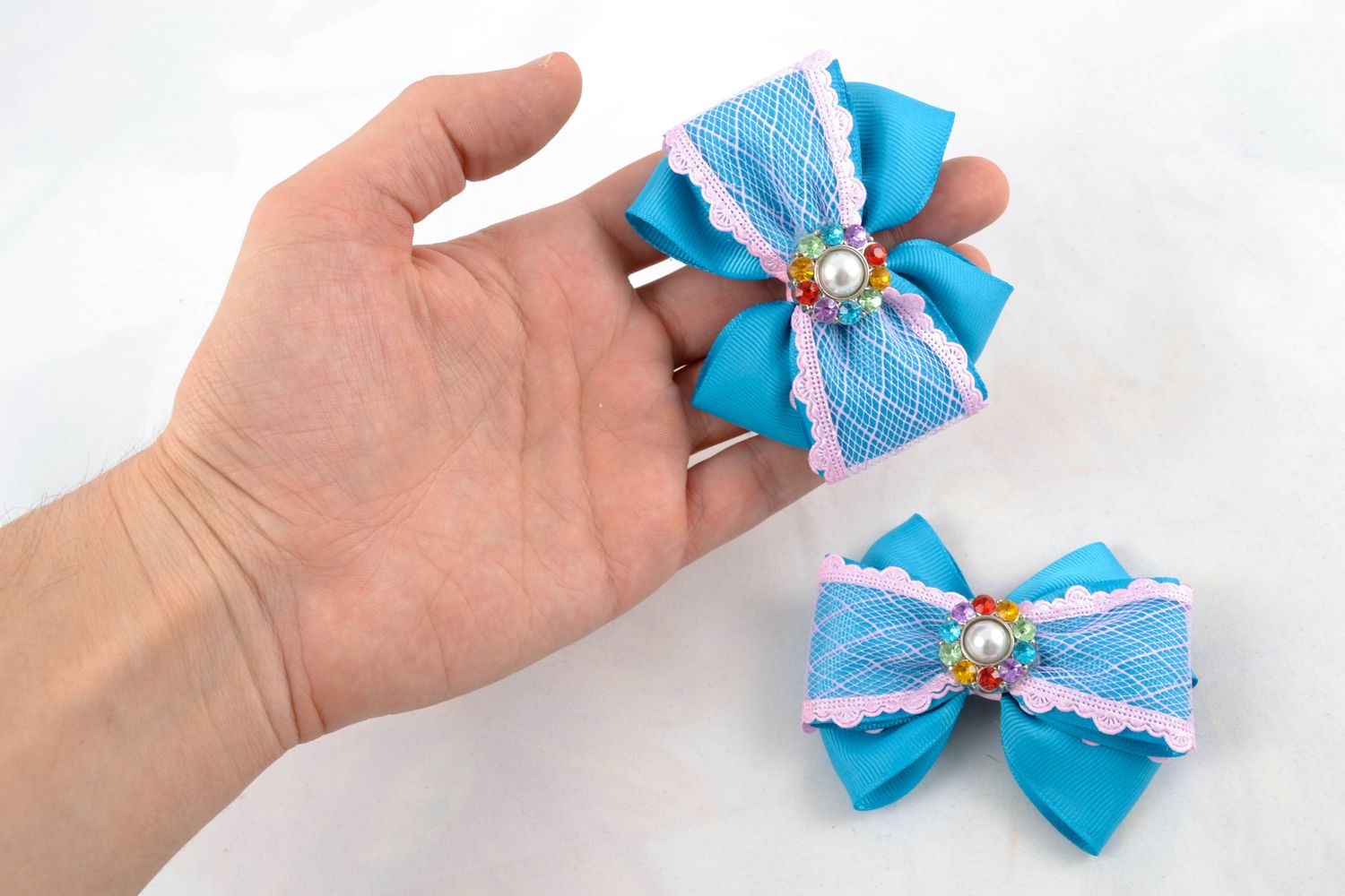 Beautiful hair clips with blue bows made of ribbons with rhinestones photo 1