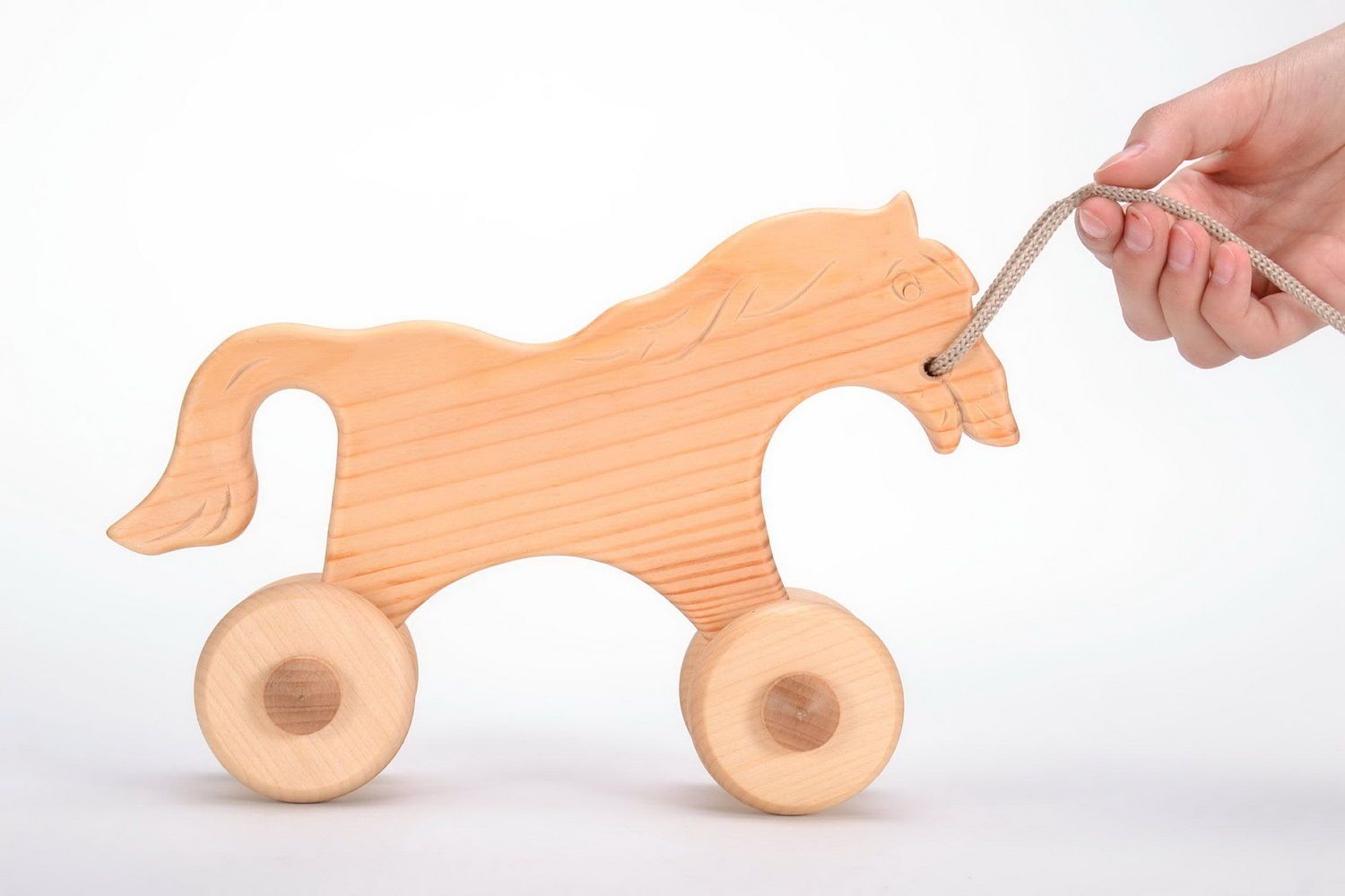 Каталка-лошадка деревянная фото 4